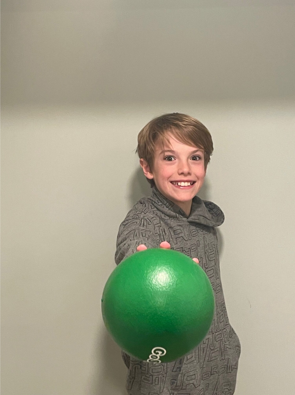 Child holding dodgeball