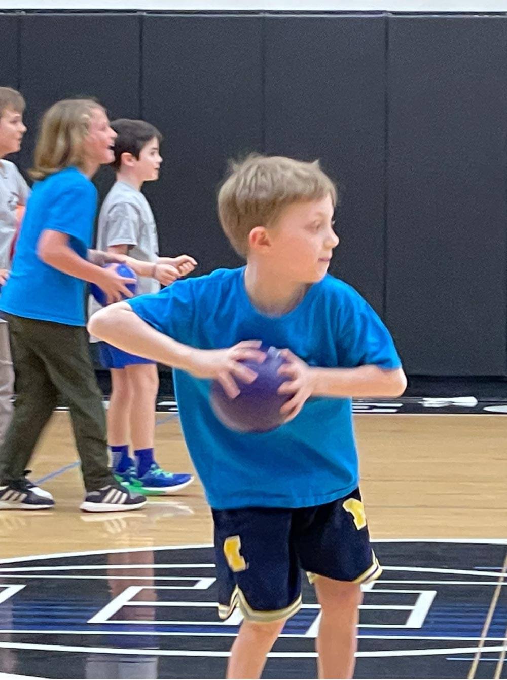 Child getting ready to throw a dodgeball